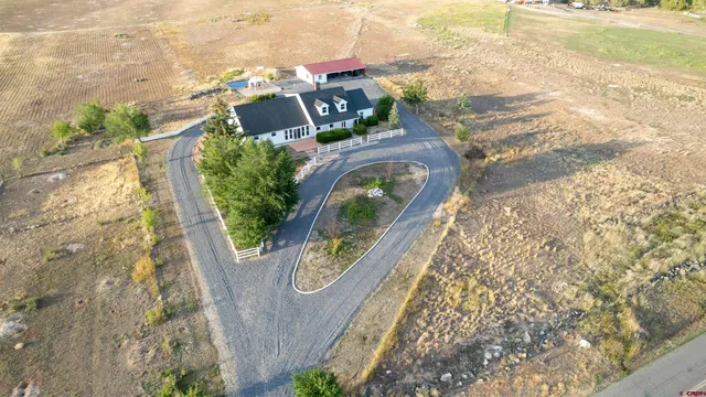 an aerial view of a house with outdoor space