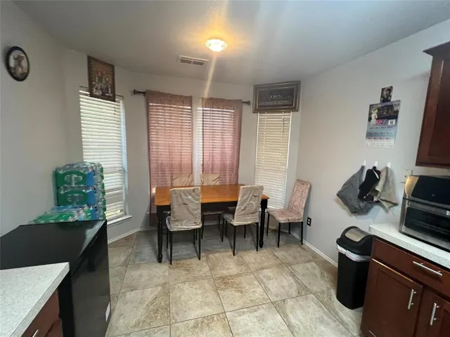 a living room with furniture a rug and a window