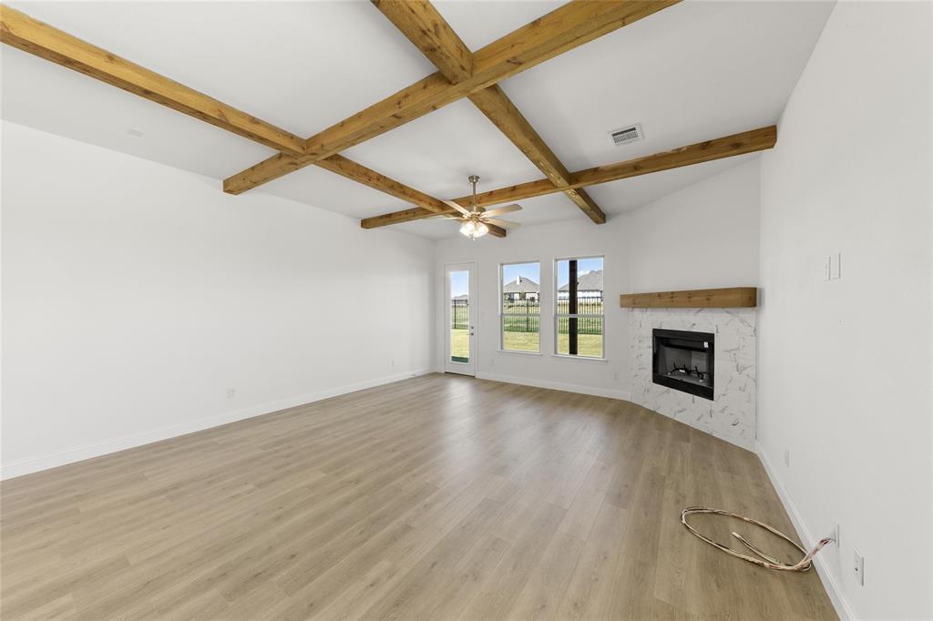 4017 Eagles Bluff Road Midlothian, TX 76065 - Photo 17 of 31 an empty room with windows and fireplace