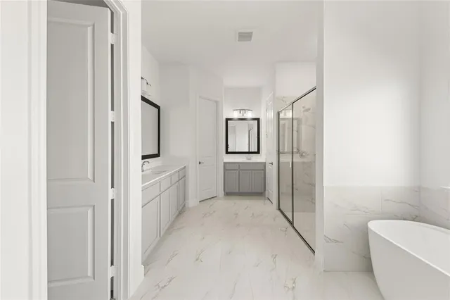 a kitchen with a refrigerator a sink