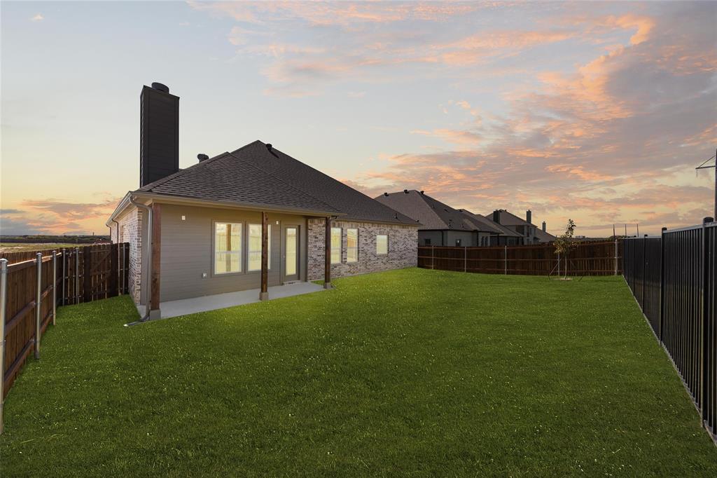 4017 Eagles Bluff Road Midlothian, TX 76065 - Photo 27 of 31 a view of a house with a yard