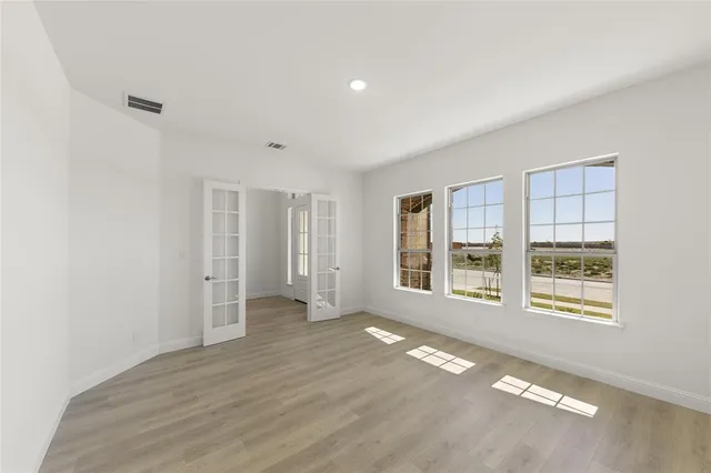 an empty room with windows