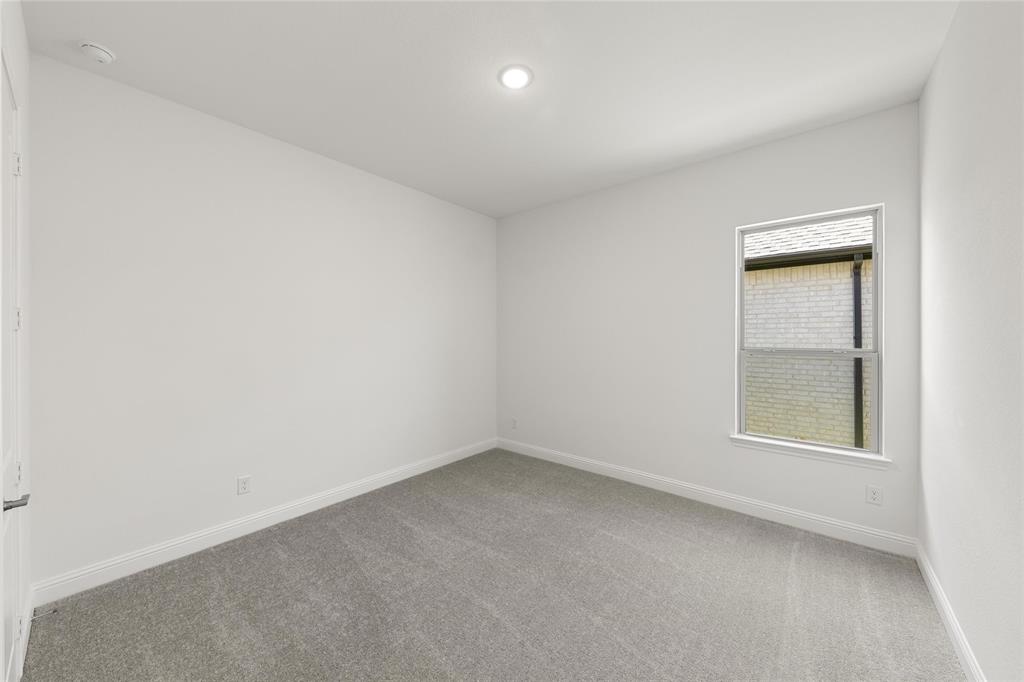 4017 Eagles Bluff Road Midlothian, TX 76065 - Photo 7 of 31 an empty room with a window