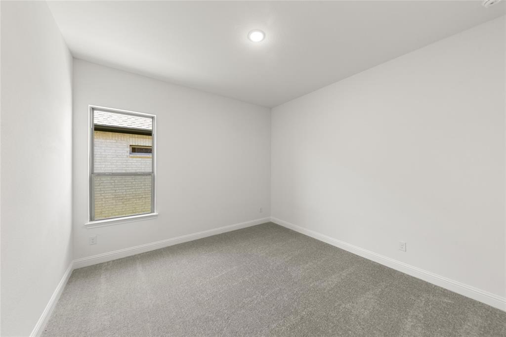 4017 Eagles Bluff Road Midlothian, TX 76065 - Photo 9 of 31 an empty room with a window and mirror