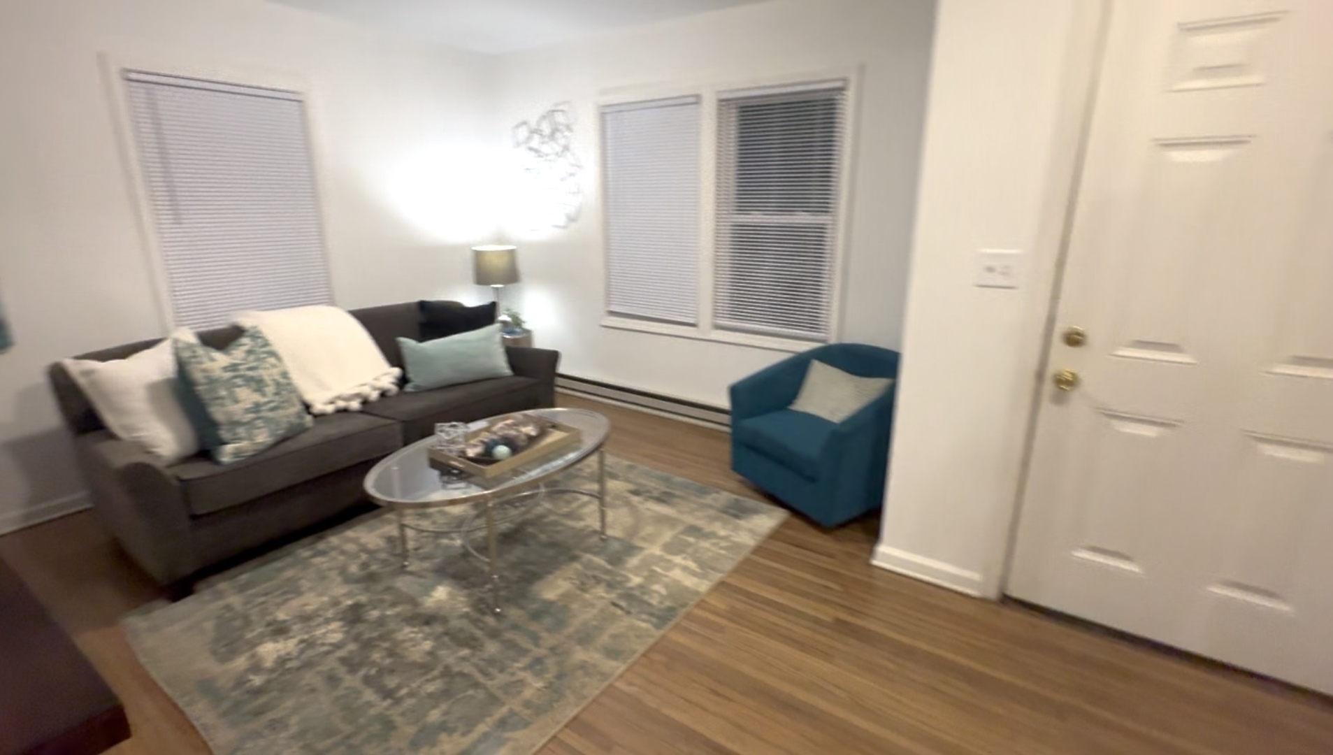 116 North 9th Street DeKalb, IL 60115 - Photo 14 of 20 a living room with furniture and a rug