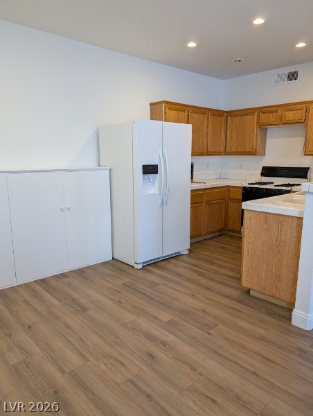 2201 Ramsgate Drive, Unit 116 Henderson, NV 89074 - Photo 10 of 13 This spacious kitchen offers a functional layout with ample cabinetry and essential appliances.