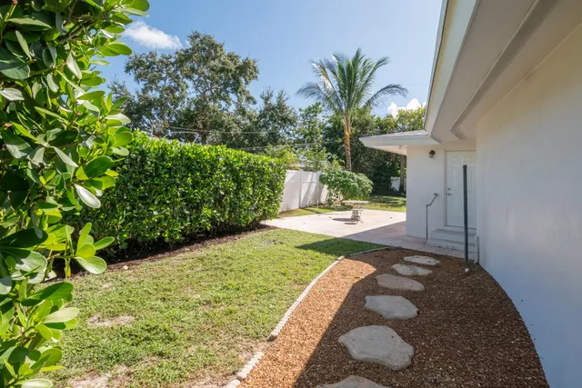 a view of a swimming pool with a garden