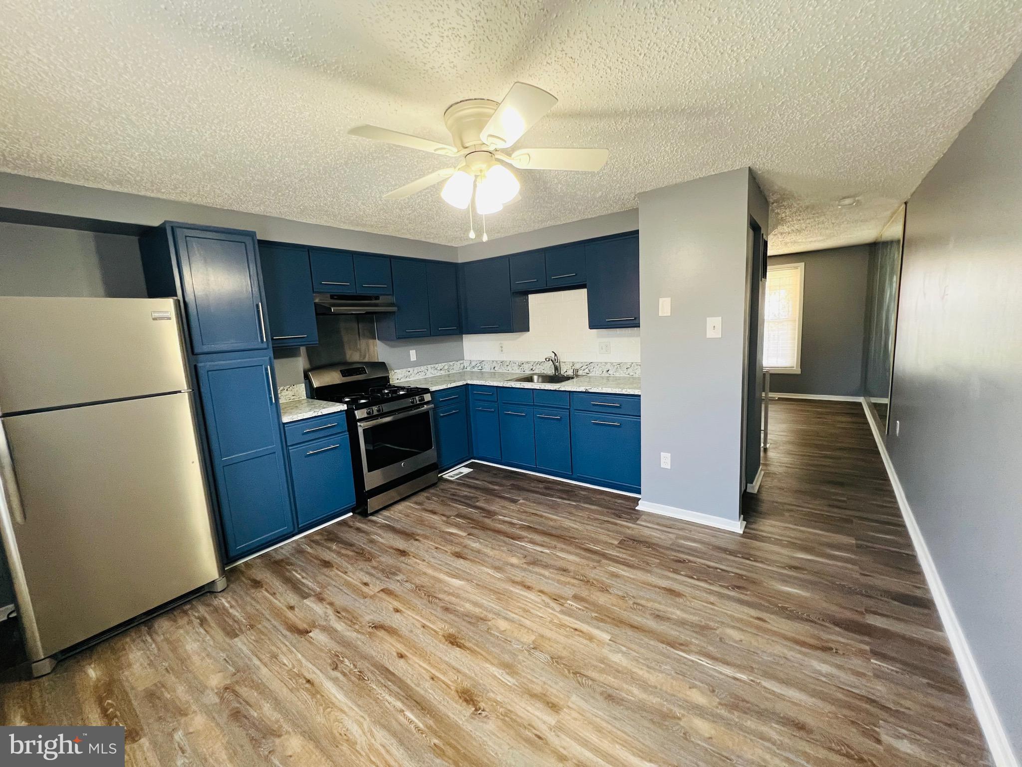 1808 North Spring Street Baltimore, MD 21213 - Photo 11 of 24 a view of kitchen with sink and refrigerator