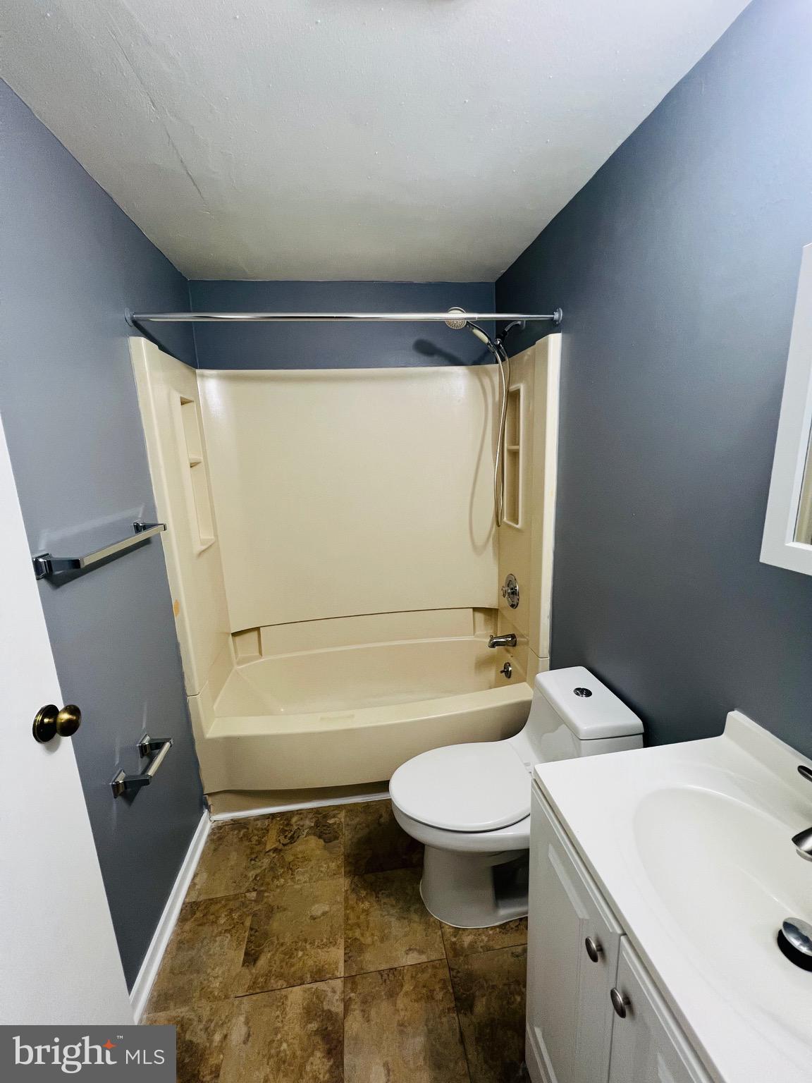 1808 North Spring Street Baltimore, MD 21213 - Photo 16 of 24 a bathroom with a sink toilet and shower