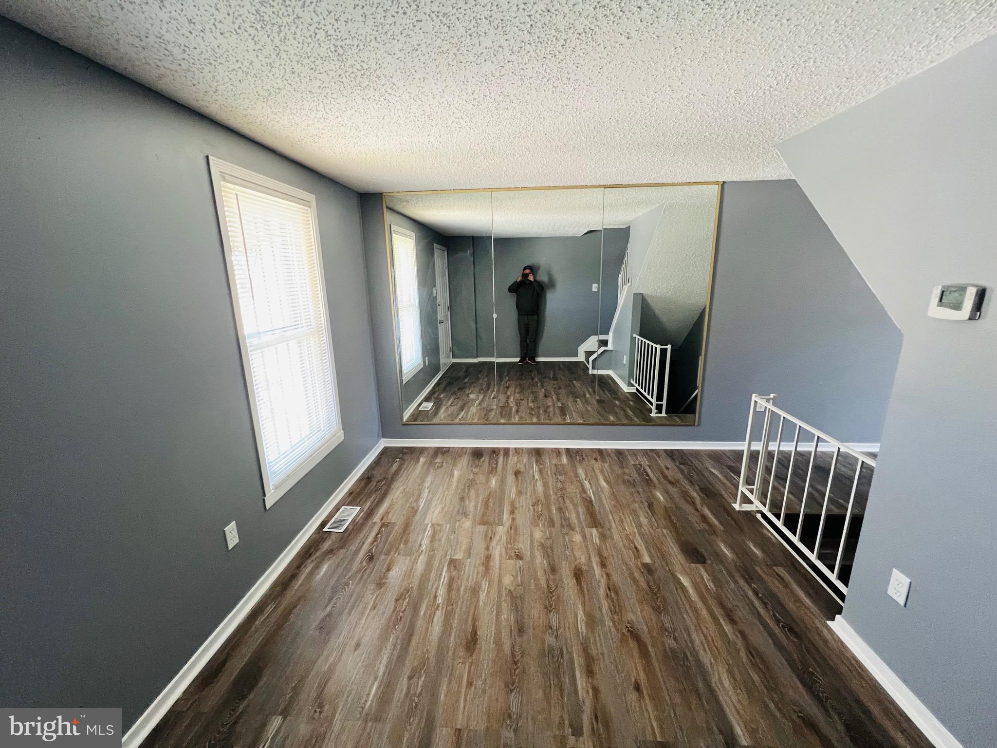 1808 North Spring Street Baltimore, MD 21213 - Photo 4 of 24 a view of wooden floor in a hall with wooden floor