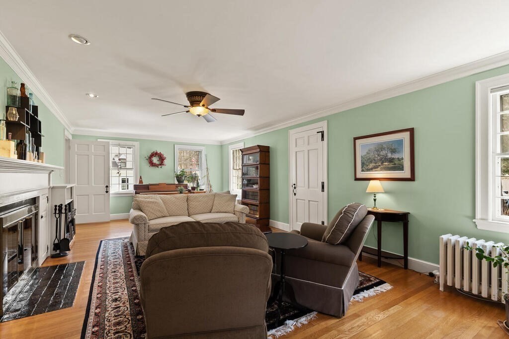 6 Lantern Lane Winchester, MA 01890 - Photo 11 of 40 a living room with furniture and a fireplace