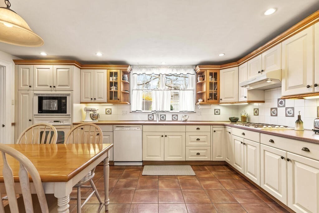 6 Lantern Lane Winchester, MA 01890 - Photo 15 of 40 a kitchen with granite countertop a sink and cabinets