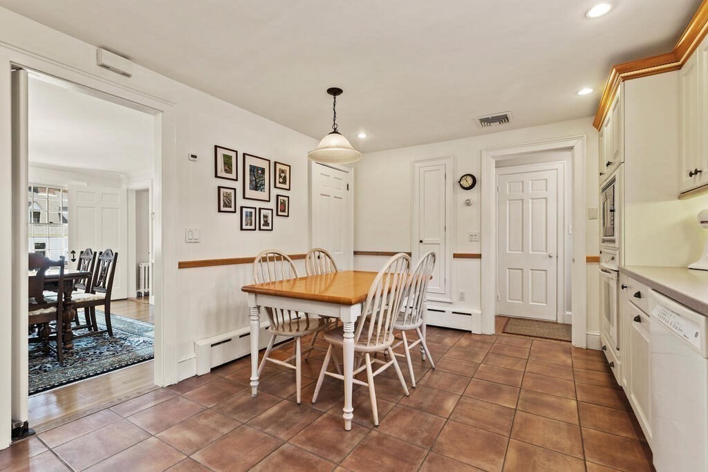 6 Lantern Lane Winchester, MA 01890 - Photo 16 of 40 a view of a dining room with furniture and chandelier