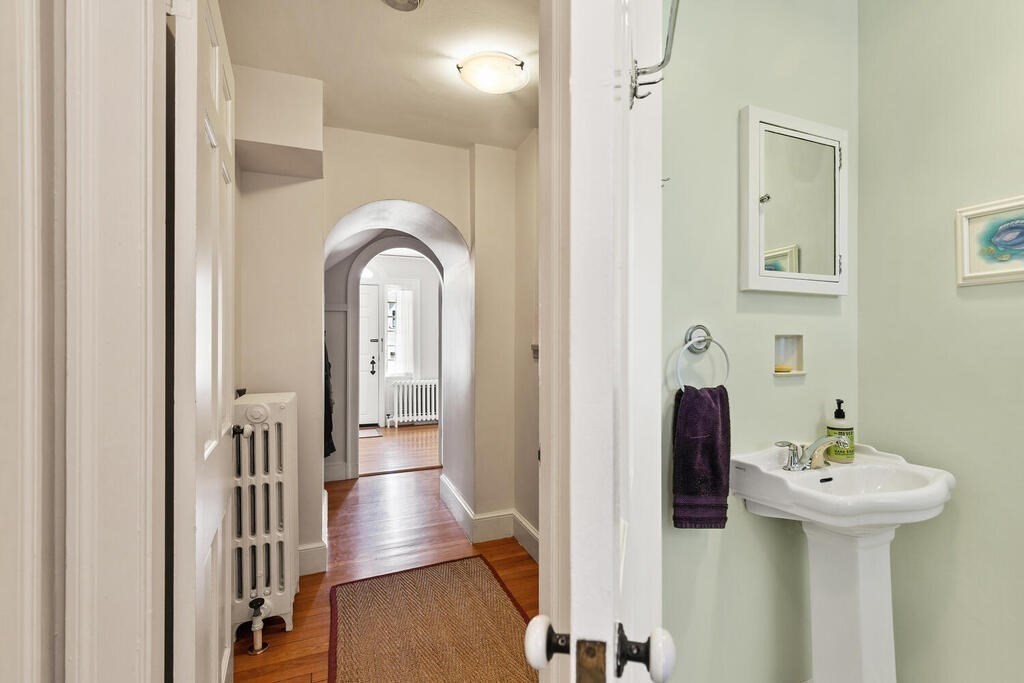 6 Lantern Lane Winchester, MA 01890 - Photo 19 of 40 a view of a hallway with entryway wooden floor and front door