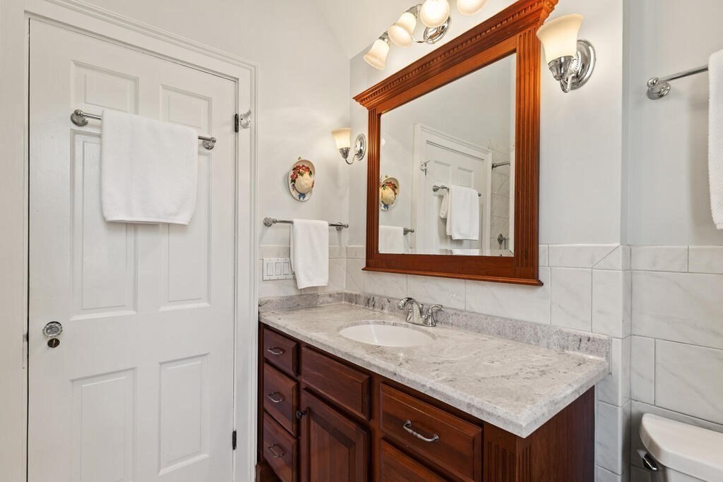 6 Lantern Lane Winchester, MA 01890 - Photo 27 of 40 a bathroom with a sink vanity and a mirror