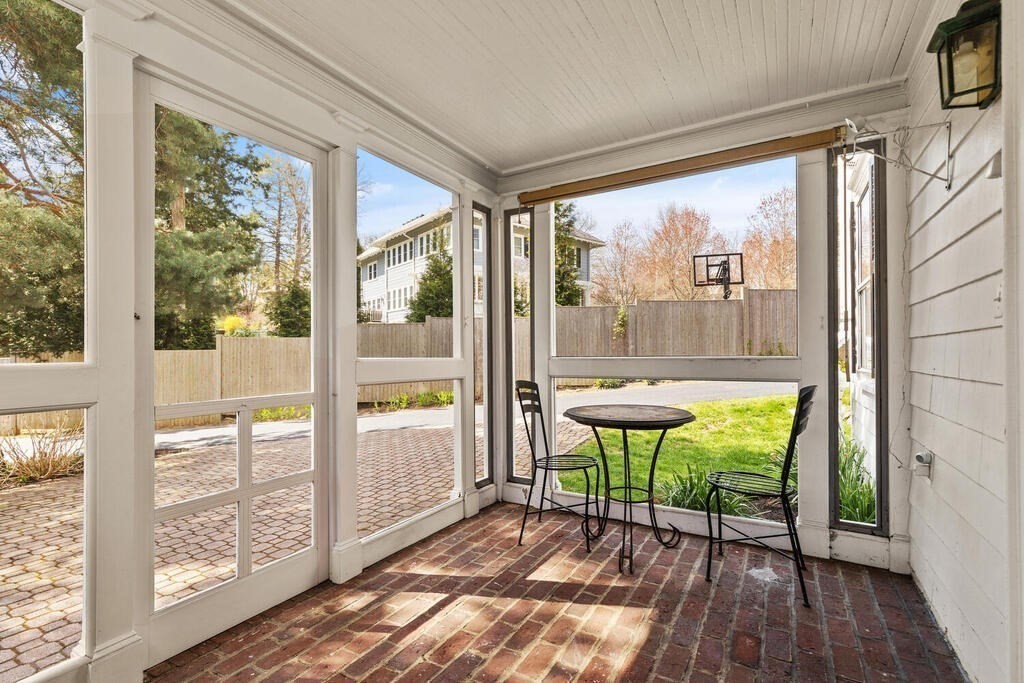 6 Lantern Lane Winchester, MA 01890 - Photo 30 of 40 a view of a room with a large window and wooden floor
