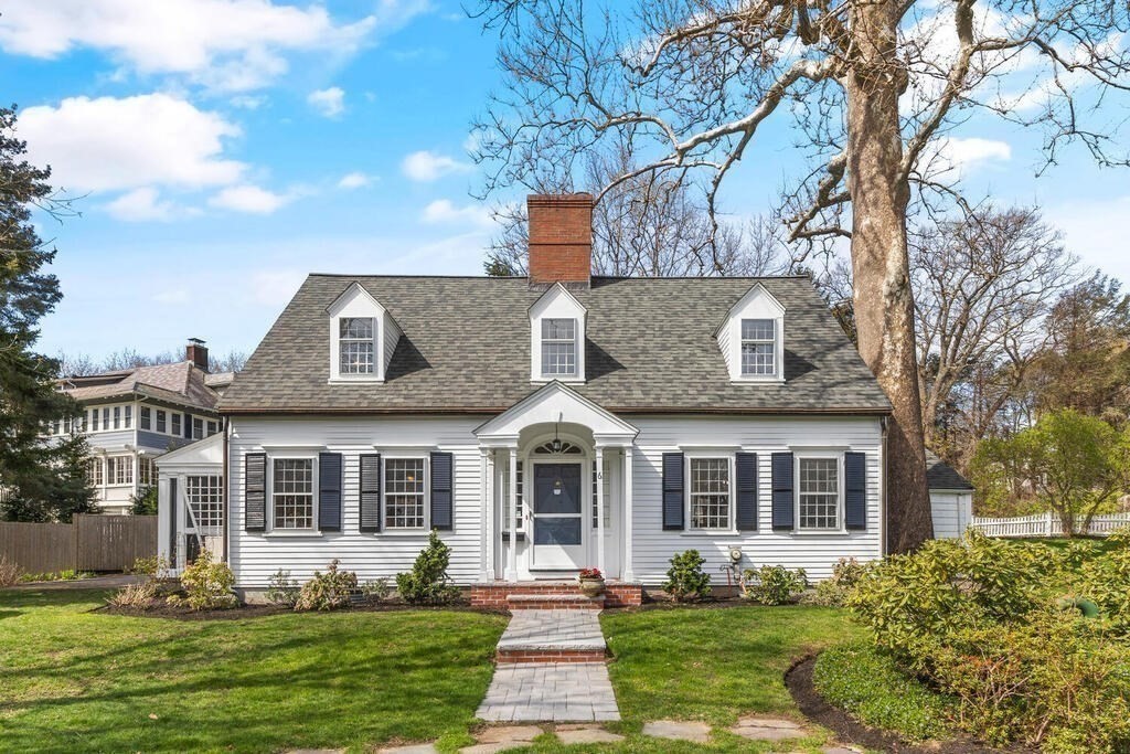 6 Lantern Lane Winchester, MA 01890 - Photo 40 of 40 a front view of a house with a yard and trees