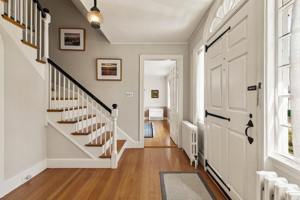 6 Lantern Lane Winchester, MA 01890 - Photo 7 of 40 a view of a hallway with wooden floor and staircase