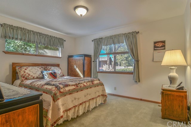 347 Donner Drive Crestline, CA 92325 - Photo 12 of 27 a bedroom with a bed and a window