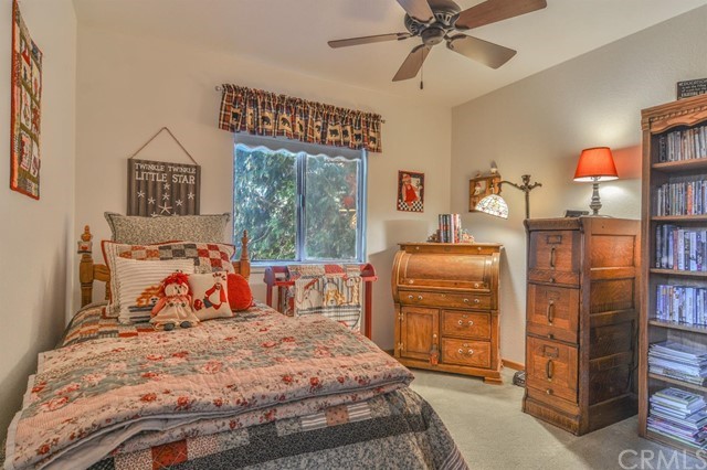 347 Donner Drive Crestline, CA 92325 - Photo 14 of 27 a bedroom with a bed and a television