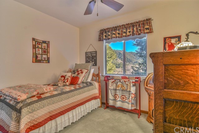 347 Donner Drive Crestline, CA 92325 - Photo 15 of 27 a bedroom with a bed and a window