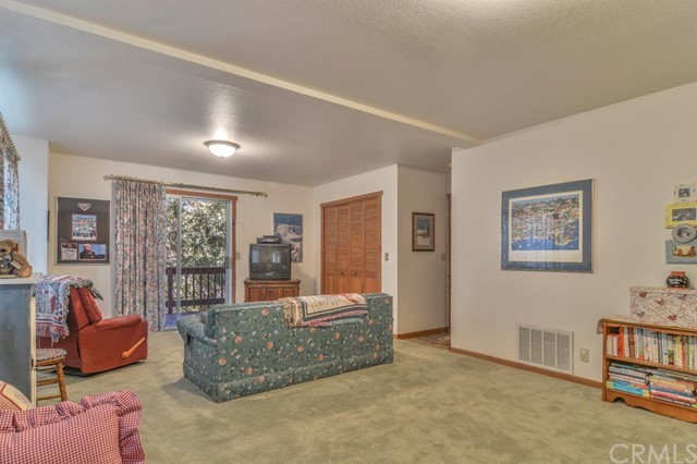 347 Donner Drive Crestline, CA 92325 - Photo 17 of 27 a living room with furniture and a window