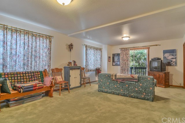 347 Donner Drive Crestline, CA 92325 - Photo 18 of 27 a living room with furniture and a window