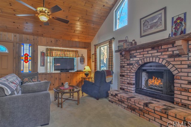 347 Donner Drive Crestline, CA 92325 - Photo 5 of 27 a living room with furniture and a fireplace