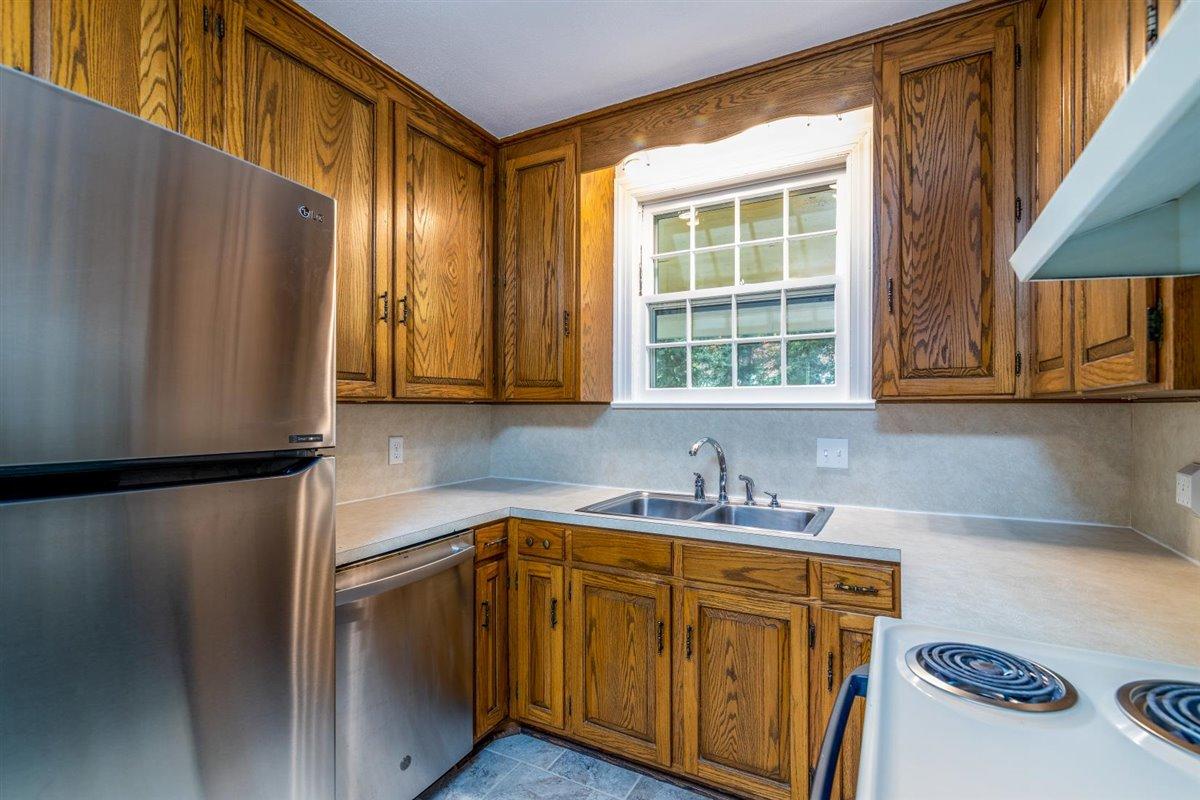 3223 Lawndale Road Roanoke, VA 24018 - Photo 11 of 37 a kitchen with stainless steel appliances a refrigerator sink and cabinets
