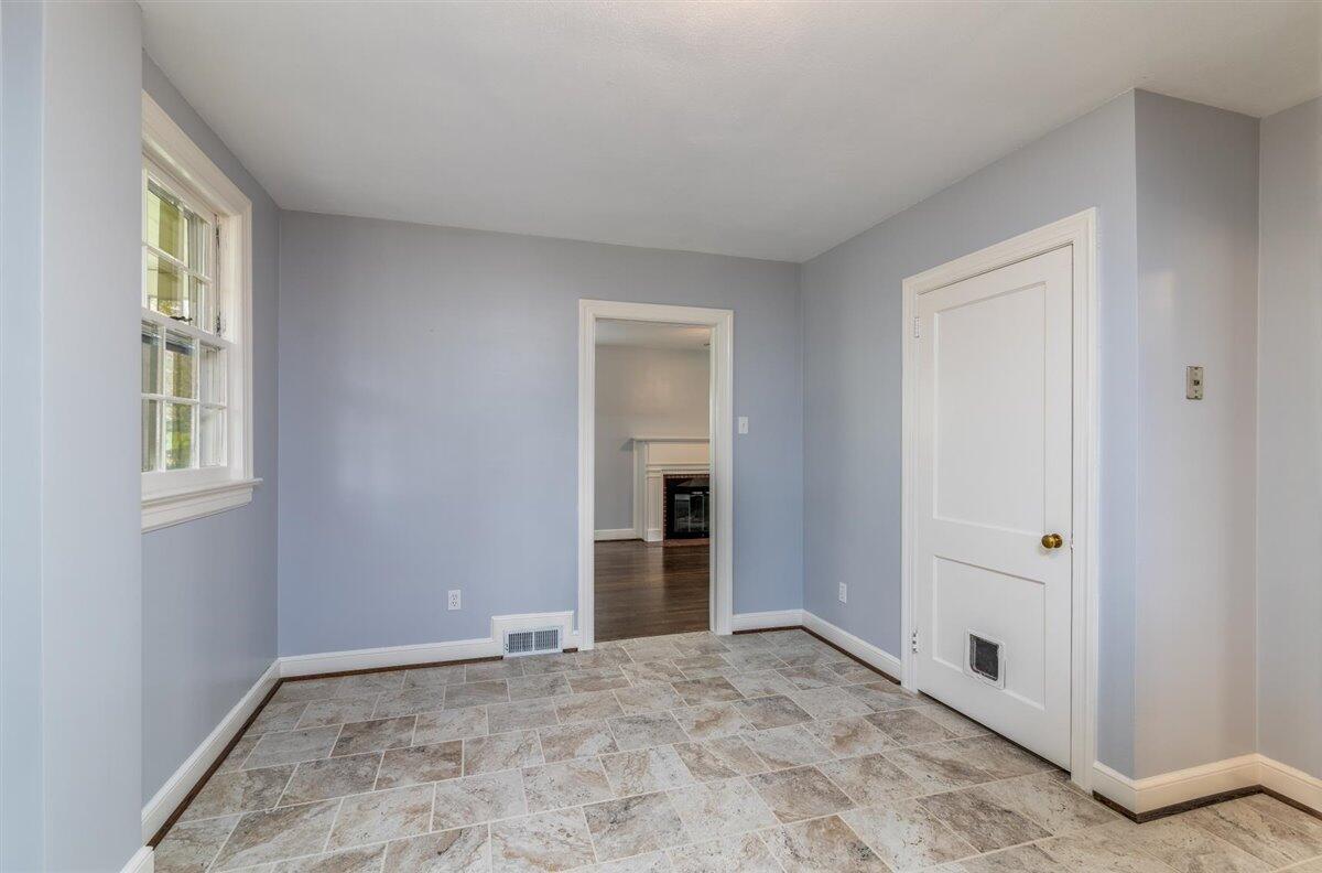 3223 Lawndale Road Roanoke, VA 24018 - Photo 13 of 37 a view of an empty room with window and hardwood floor