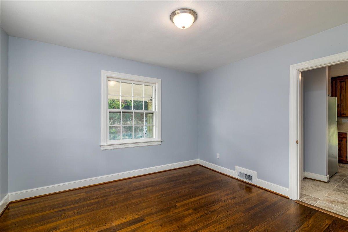 3223 Lawndale Road Roanoke, VA 24018 - Photo 17 of 37 an empty room with wooden floor and windows