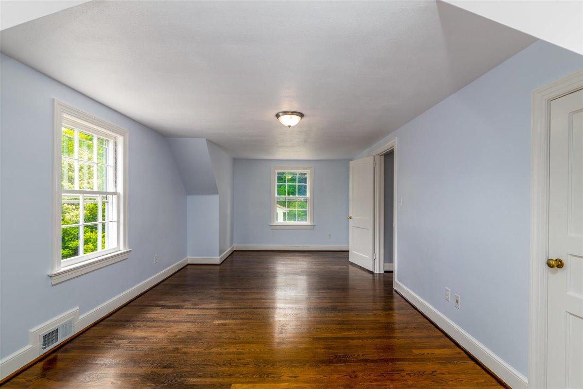 3223 Lawndale Road Roanoke, VA 24018 - Photo 24 of 37 a view of an empty room with wooden floor and a window