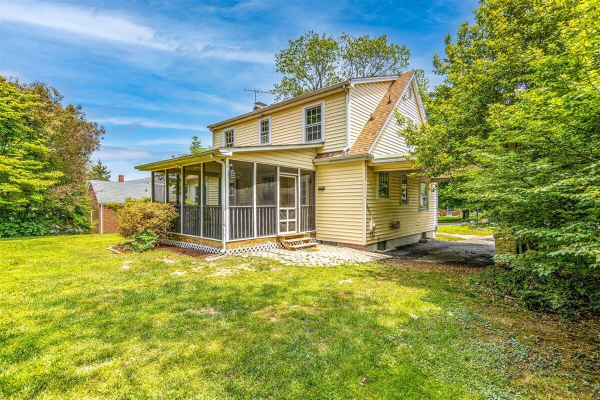 3223 Lawndale Road Roanoke, VA 24018 - Photo 36 of 37 a view of a yard in front of a house with a large tree