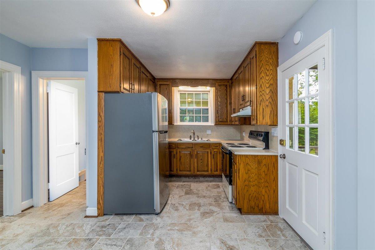 3223 Lawndale Road Roanoke, VA 24018 - Photo 10 of 37 a kitchen with sink refrigerator and window