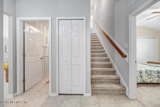 a view of entryway with stairs and wooden floor