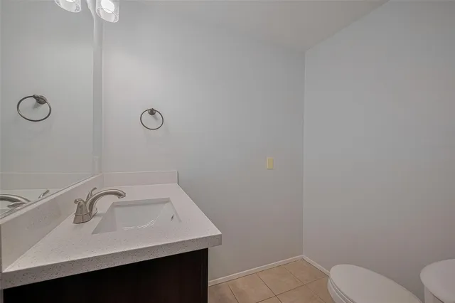 a bathroom with a sink toilet and vanity