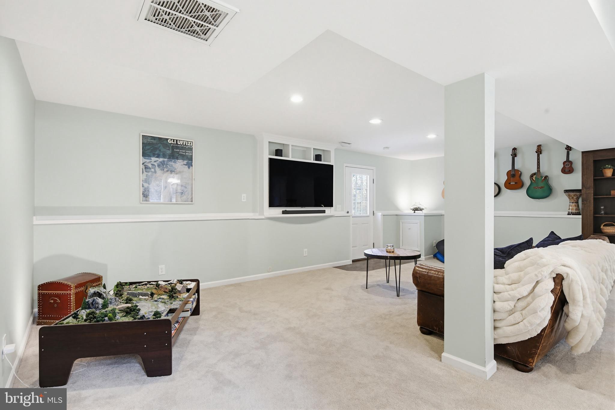 3229 Beards Point Road Davidsonville, MD 21035 - Photo 62 of 69 a living room with furniture and a flat screen tv