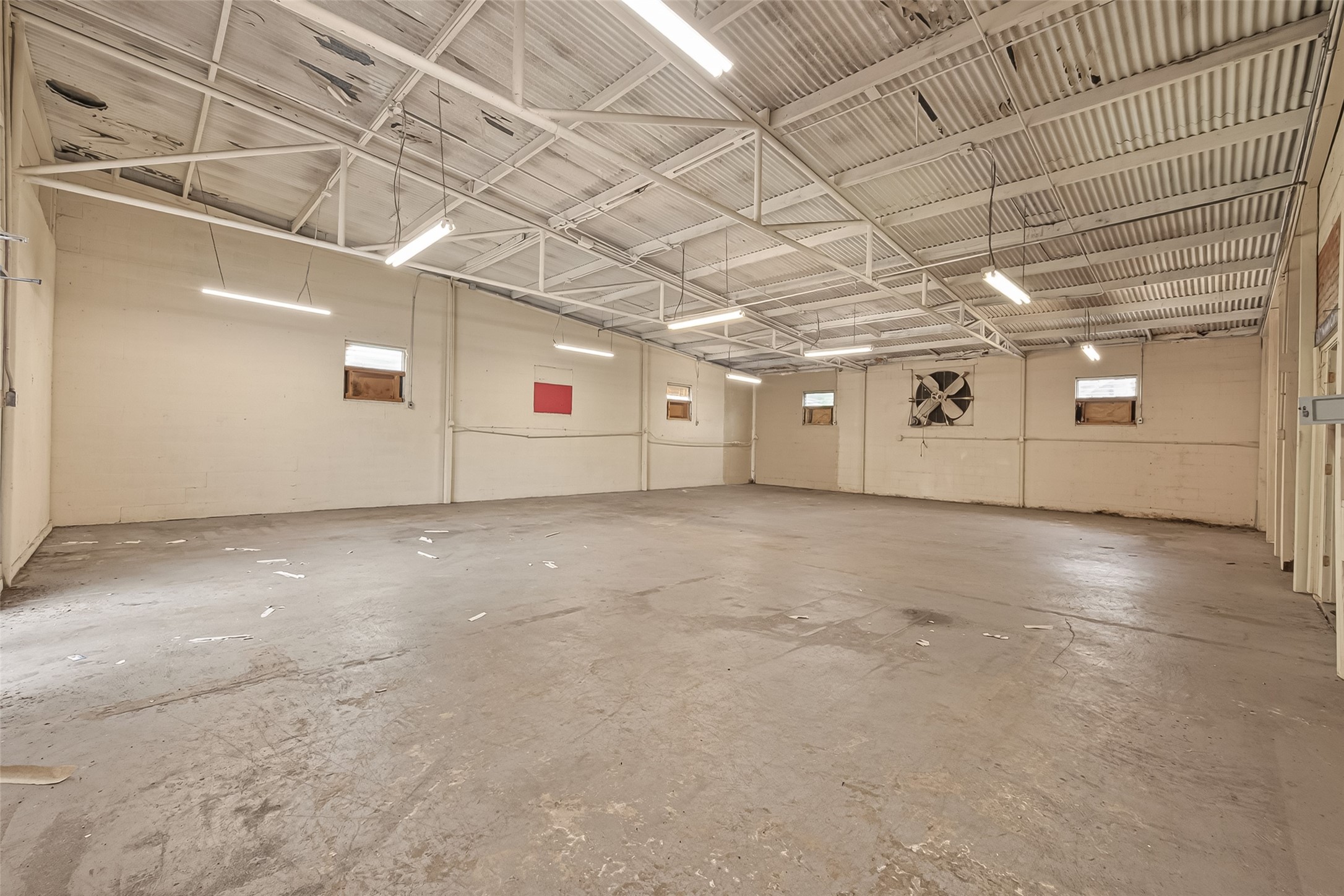 2102 Common Street Houston, TX 77009 - Photo 4 of 22 Expansive open-concept interior featuring high ceilings, exposed structural elements, and flexible layout options.