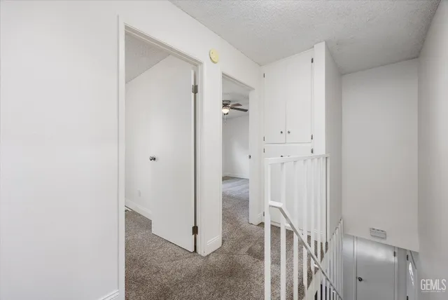 a view of a hallway with closet and entryway