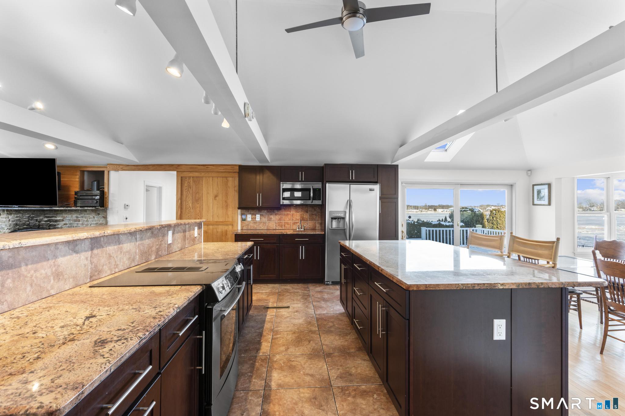231 Pawson Road Branford, CT 06405 - Photo 11 of 17 a large kitchen with kitchen island granite countertop a large counter top and sink