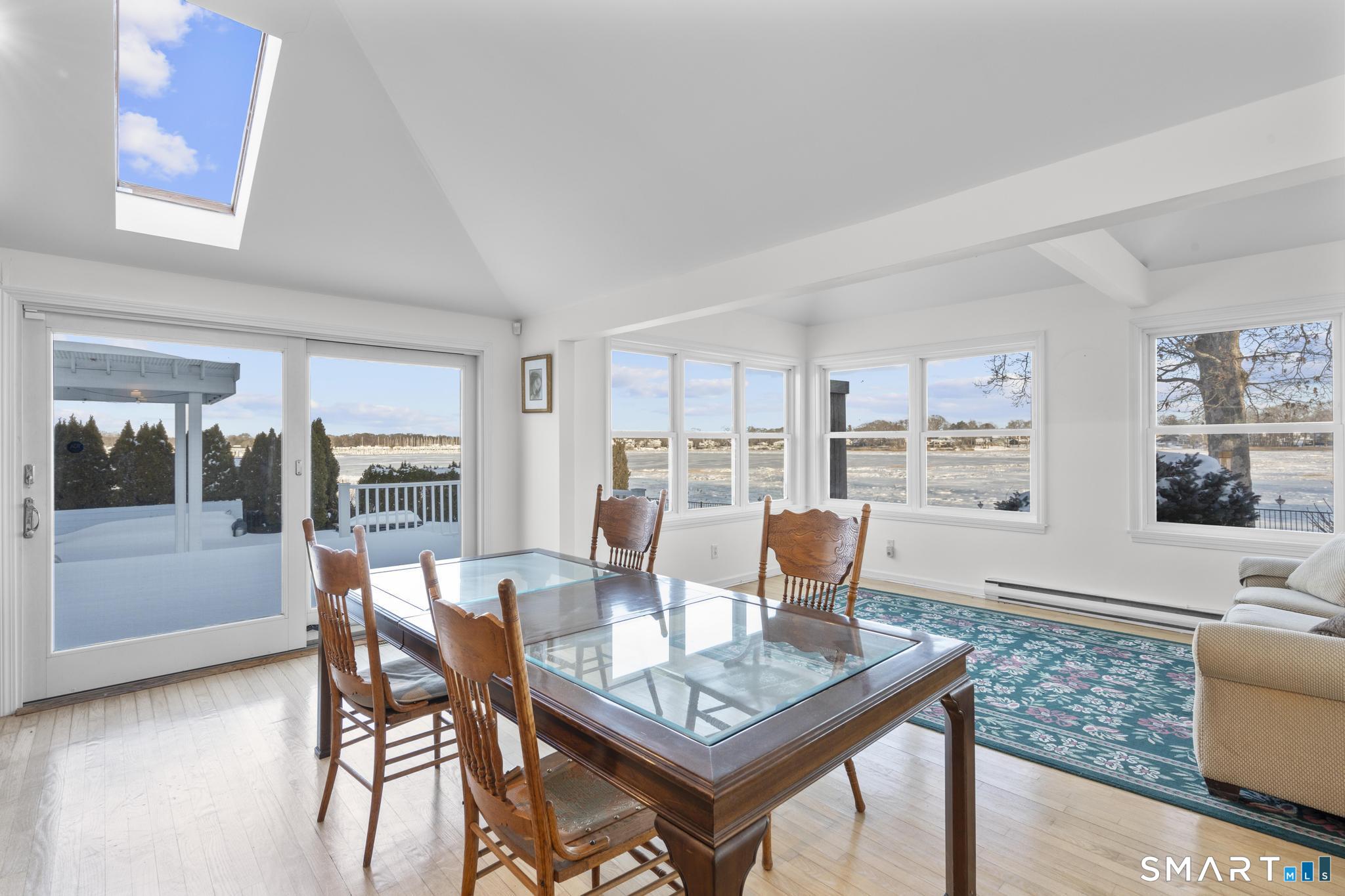 231 Pawson Road Branford, CT 06405 - Photo 12 of 17 a dining room with furniture and wooden floor