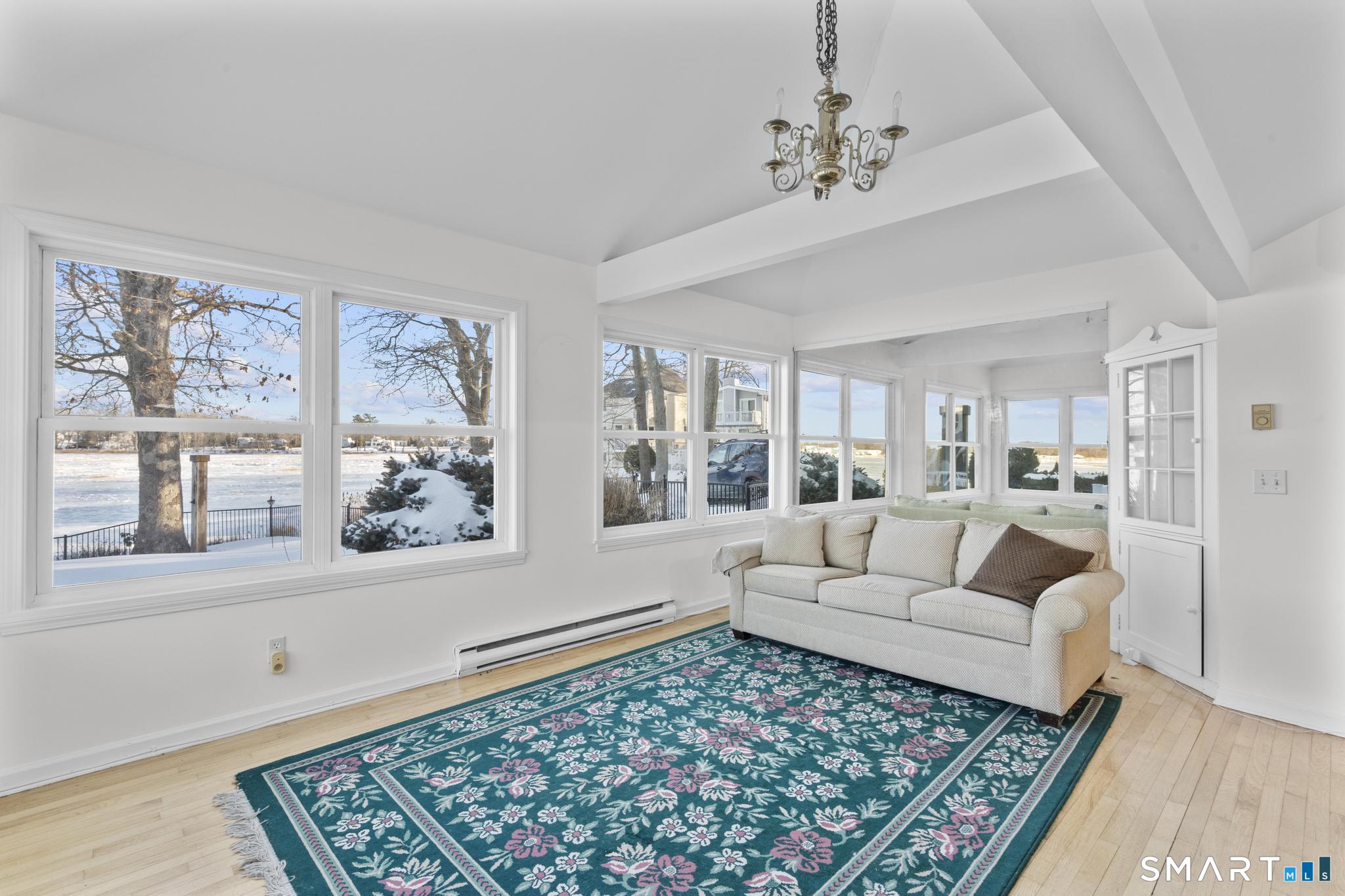 231 Pawson Road Branford, CT 06405 - Photo 13 of 17 a living room with furniture and a rug