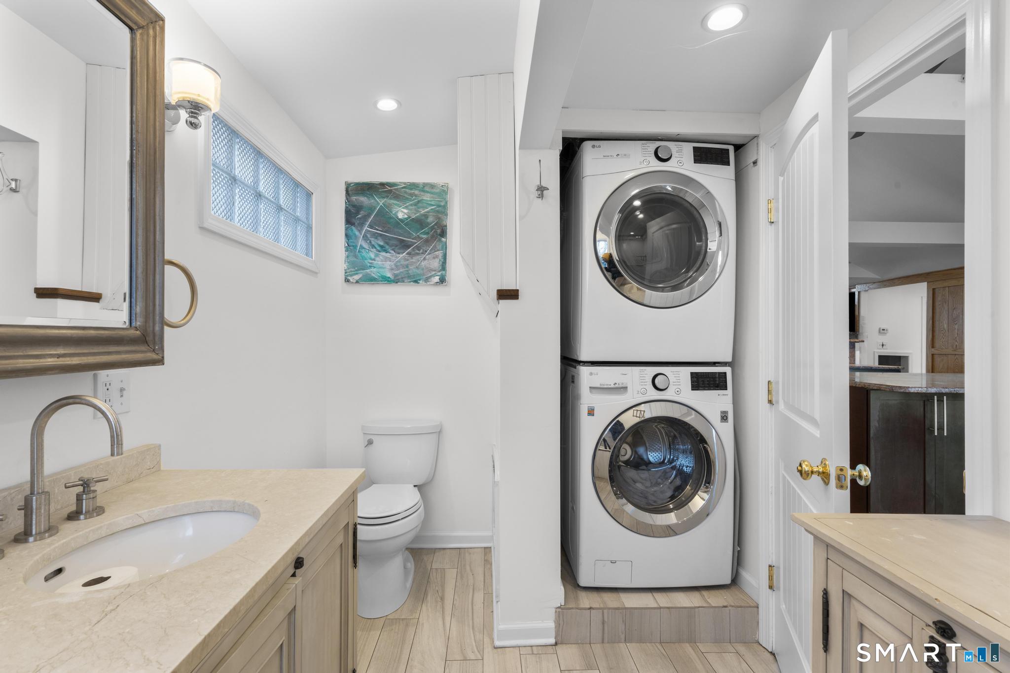 231 Pawson Road Branford, CT 06405 - Photo 14 of 17 a utility room with sink dryer and washer