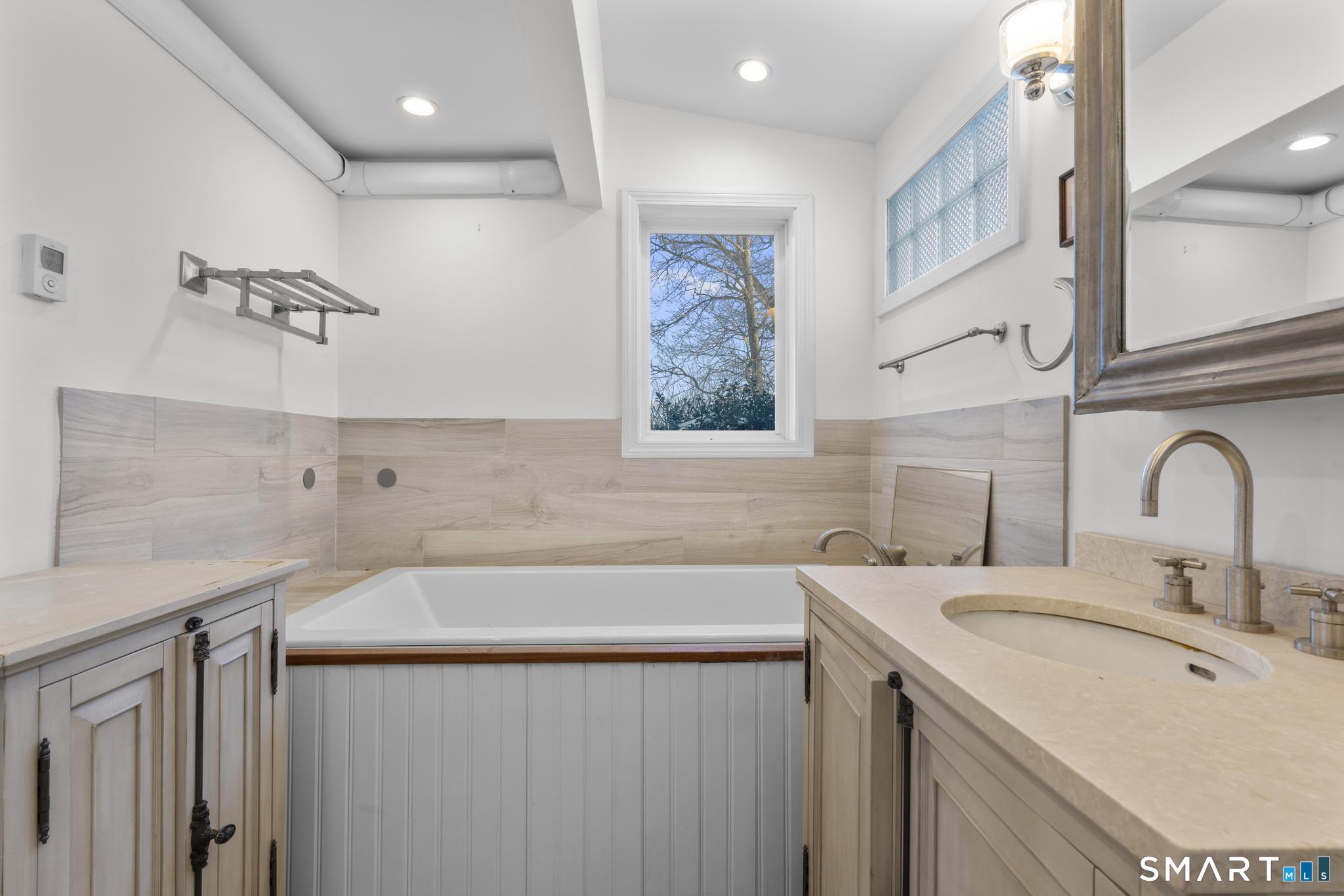 231 Pawson Road Branford, CT 06405 - Photo 17 of 17 a bathroom with a sink and a bathtub