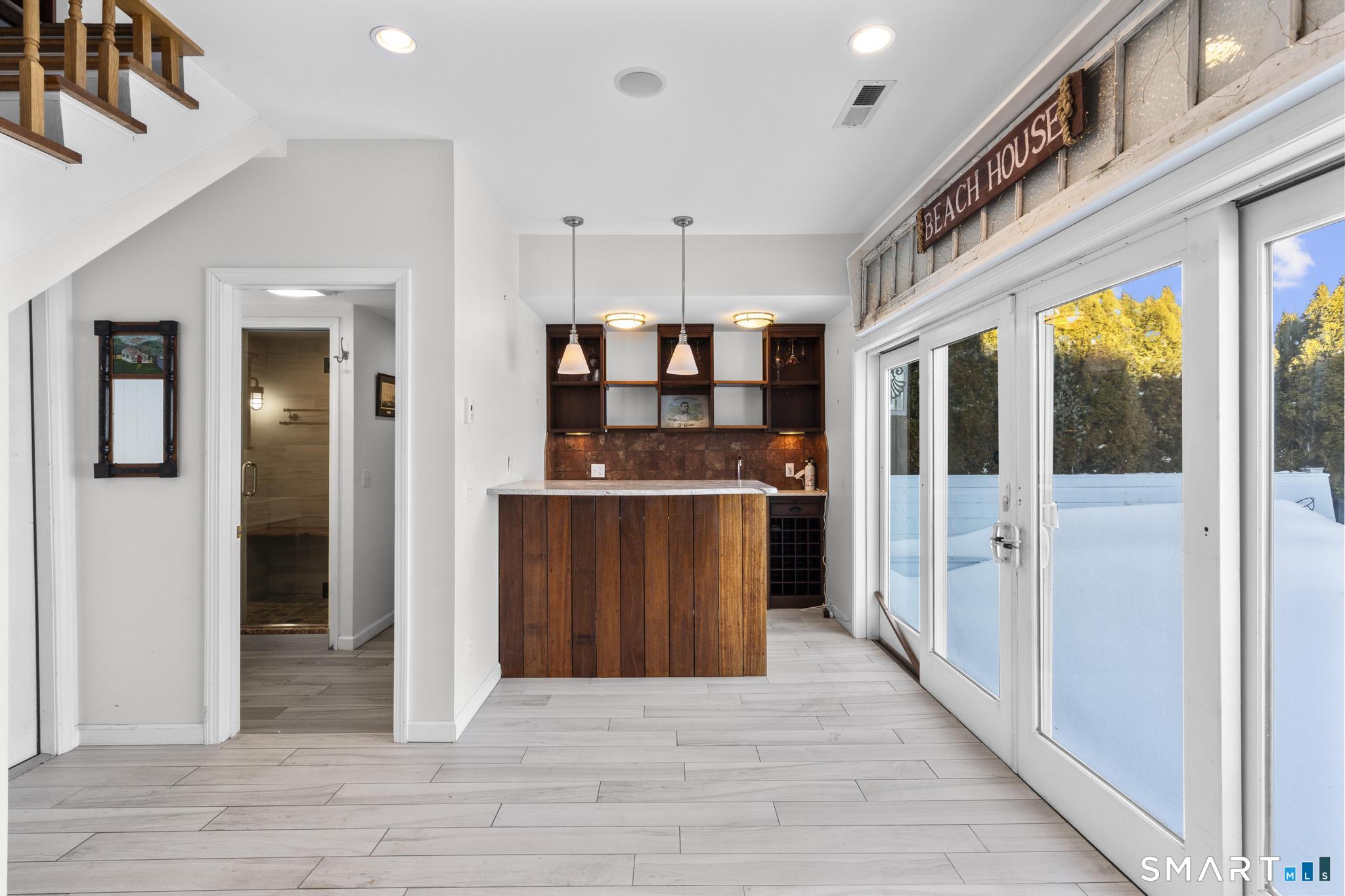231 Pawson Road Branford, CT 06405 - Photo 5 of 17 a view of a hallway with a living room