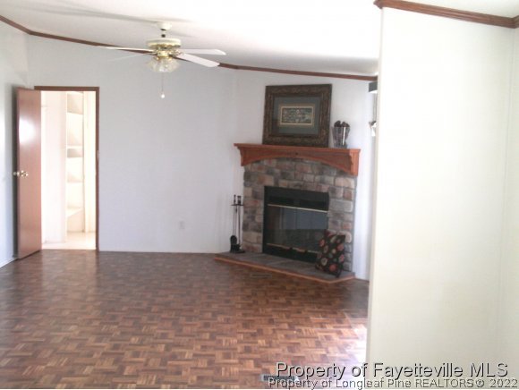4960 Lobelia Road Vass, NC 28394 - Photo 13 of 25 a view of an empty room with a fireplace