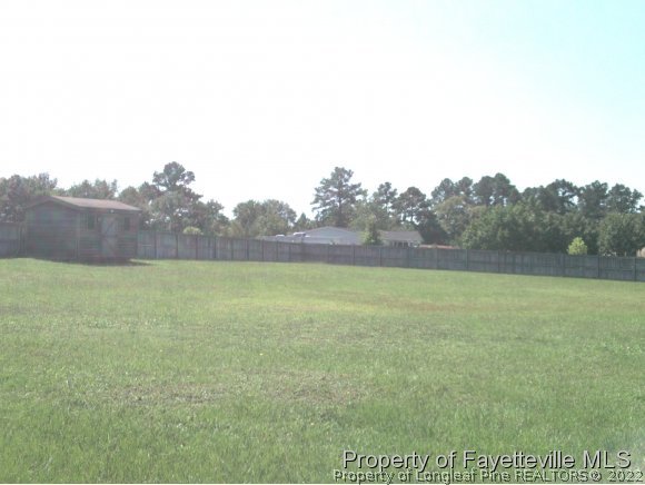 4960 Lobelia Road Vass, NC 28394 - Photo 3 of 25 a view of a field of grass and trees