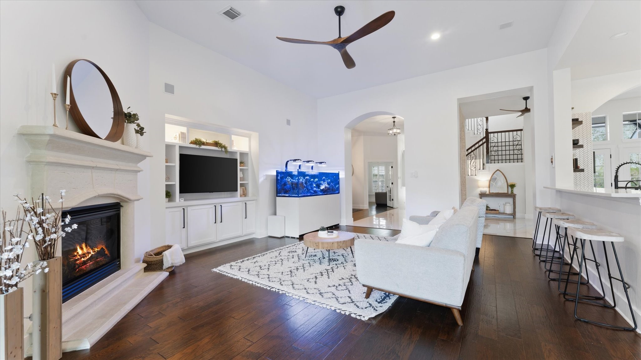 2 South Winsome Path Circle Spring, TX 77382 - Photo 16 of 47 a living room with furniture a fireplace and a flat screen tv