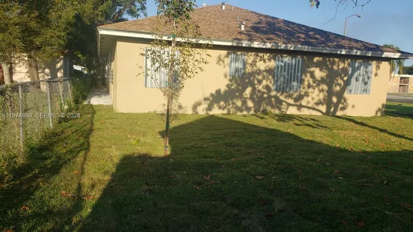 a view of a yard with an outdoor space
