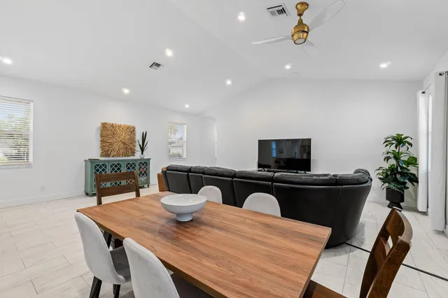 a kitchen with a table and chairs in it